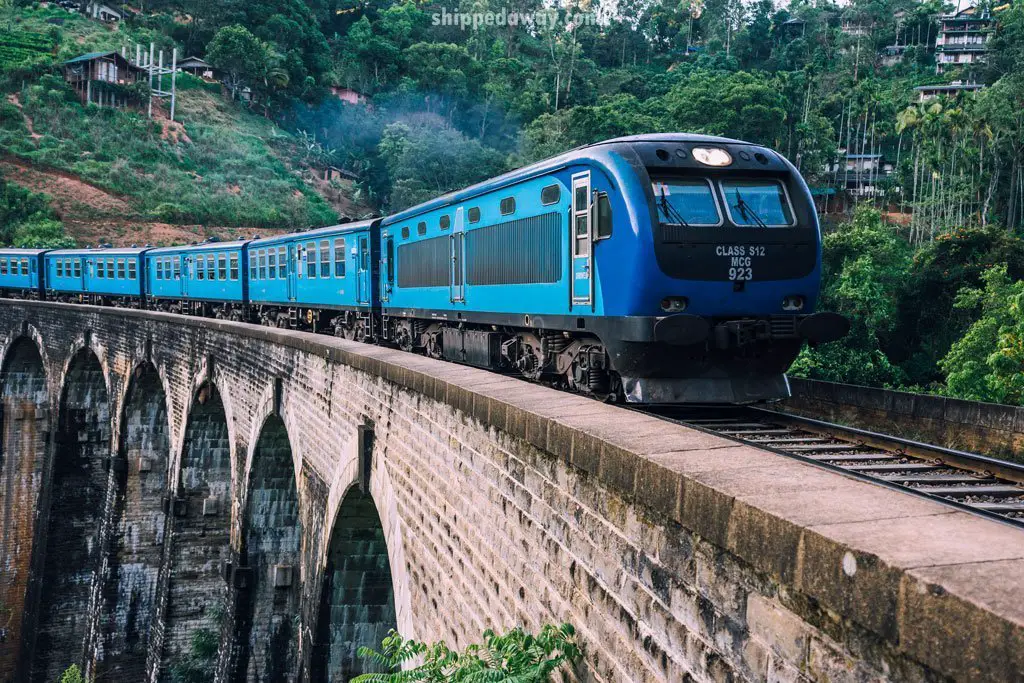 Blue train on Nine Arches Bridge in Ella, Sri Lanka