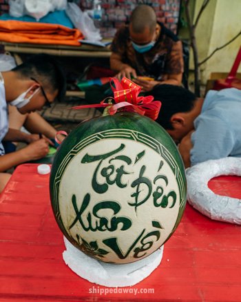 New Year's wishes carved into a watermelon during Tet, Vietnamese New Year